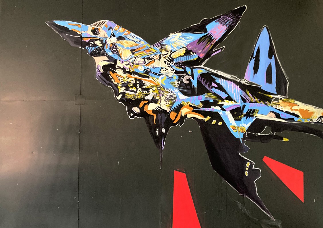 Large-format jet mural on a green wall